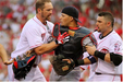St. Louis catcher Jason LaRue suffered a concussion, broken ribs and facial injuries in a brawl involving at least 50 players and coaches.