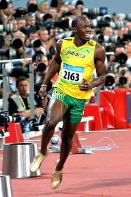 Usain Bolt celebrates after his 100 meter win at the Beijing Olympics. Photo by Richard Giles. Usain Bolt