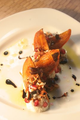 is salad of persimmons, burrata, smoked almonds and pomegranate seeds drizzled with reduced balsamic and olive oil is divine. persimmon salad