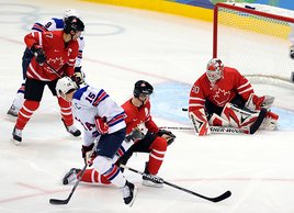 Canada's Martin Brodeur can't stop a shot from team United States in the first period at Canada Hockey Place. (United Press International)