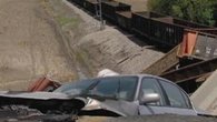 Raw: Train Derails After Overpass Collapse