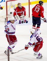 New York Rangers right wing Marian Gaborik (10), left, celebrates with teammate New York Rangers left wing Carl Hagelin (62), right,  as he scores on Washington Capitals goalie Braden Holtby (70), top, in the third overtime period as the Washington Capitals lose to the New York Rangers, 2-1, in playoff NHL hockey at the Verizon Center, Washington, D.C., Thursday, May 3, 2012. (Andrew Harnik/The Washington Times)