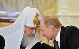 **FILE** Russian Prime Minister Vladimir Putin (right) speaks Feb. 8, 2012, with Russian Orthodox Patriarch Kirill during his meeting with Russia's religious leaders in the St. Daniel Monastery in Moscow. (Associated Press/RIA-Novosti, Yana Lapikova, Government Press Service)