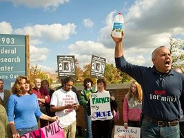 **FILE** Mark McAfee (right), founder of Fresno, Calif.-based Organic Pastures Dairy, leads a Nov. 1, 2011, protest in front of the Food and Drug Administration headquarters in Silver Spring, Md., against the FDA's ban on interstate transport of raw milk. (Rod Lamkey Jr./The Washington Times)
