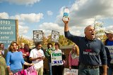 **FILE** Mark McAfee (right), founder of Fresno, Calif.-based Organic Pastures Dairy, leads a Nov. 1, 2011, protest in front of the Food and Drug Administration headquarters in Silver Spring, Md., against the FDA's ban on interstate transport of raw milk. (Rod Lamkey Jr./The Washington Times)