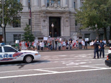 A group of young people gather outside the John A. Wilson Building to protest for more gun rights on Friday. (Tom Howell Jr./The Washington Times)