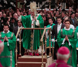 ** FILE ** Pope Benedict XVI leaves St. Peter's Basilica on a mobile platform at the end of a Mass at the Vatican on Sunday, Oct. 16, 2011. (AP Photo/Gregorio Borgia)