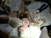 Chinese state media say firefighters and medics rescued a newborn baby boy from a sewer pipe beneath a squat toilet. (Screenshot from Associated Press video)