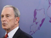 New York City Mayor Michael Bloomberg speaks while a map of the projected 2050s 100-year flood plain of New York City is displayed in New York, Tuesday, June 11, 2013. The projections paint an unsettling picture of New York's future: a city where by the 2050s, 800,000 people could be living in a flood zone that would cover a quarter of the land, and there could be as many 90-degree days as is now normal for Birmingham, Ala. (AP Photo/Seth Wenig)