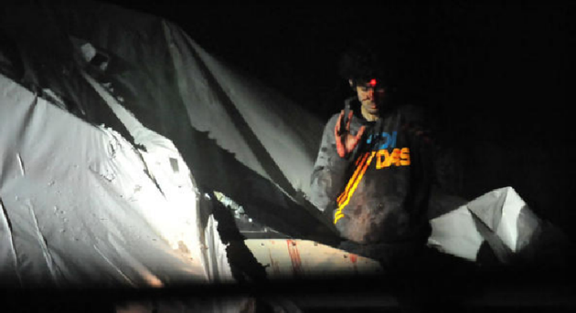 ** FILE ** A sniper targets Boston Marathon bombing suspect Dzhokhar Tsarnaev, who was hiding in a boat in a backyard in Watertown, Mass. (Screenshot of photo released by Sgt. Sean Murphy to Boston Magazine)