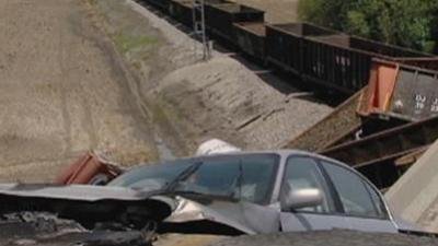 Raw: Train Derails After Overpass Collapse