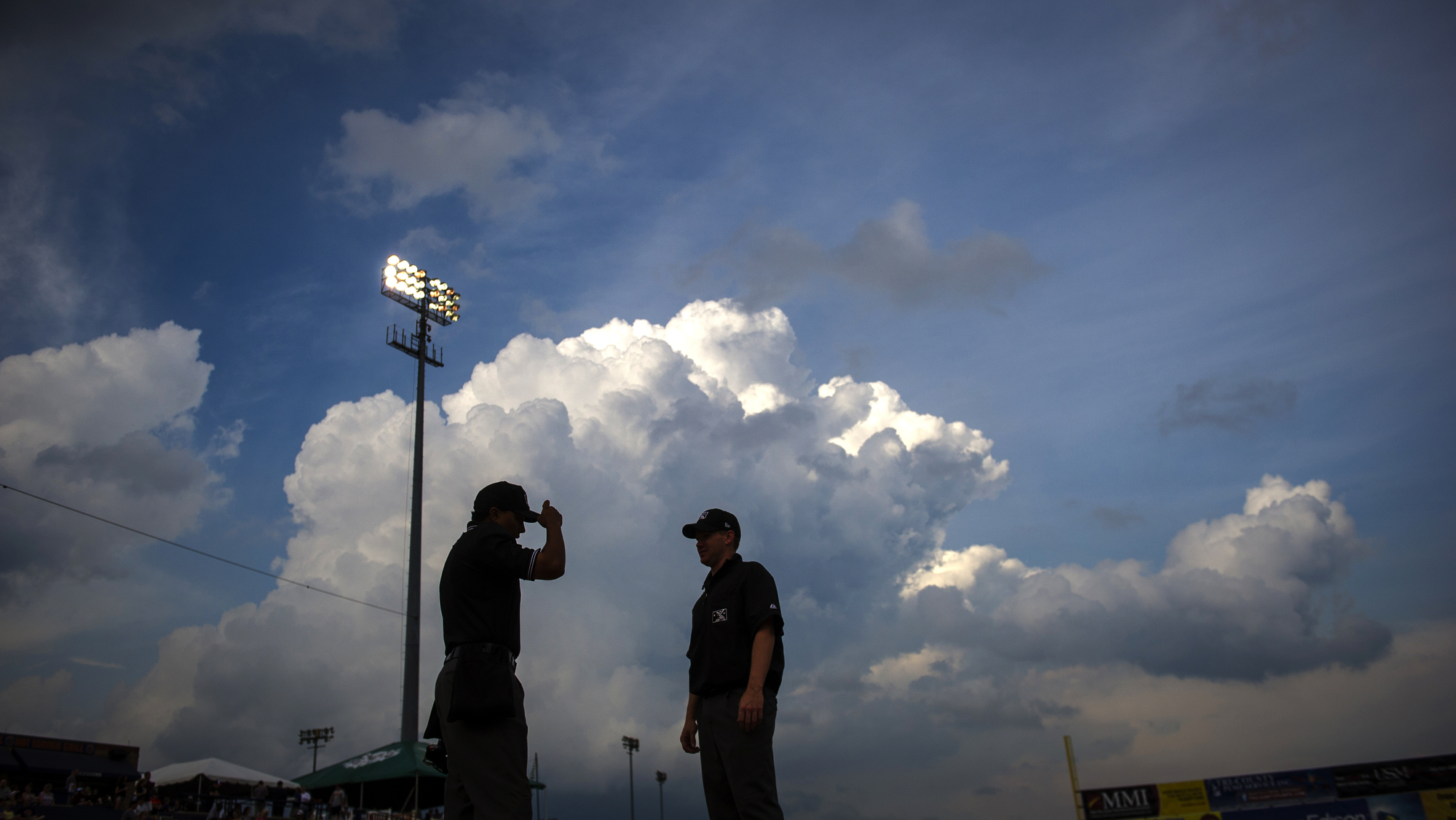 Major League umpire Erich Bacchus looks on during the game between