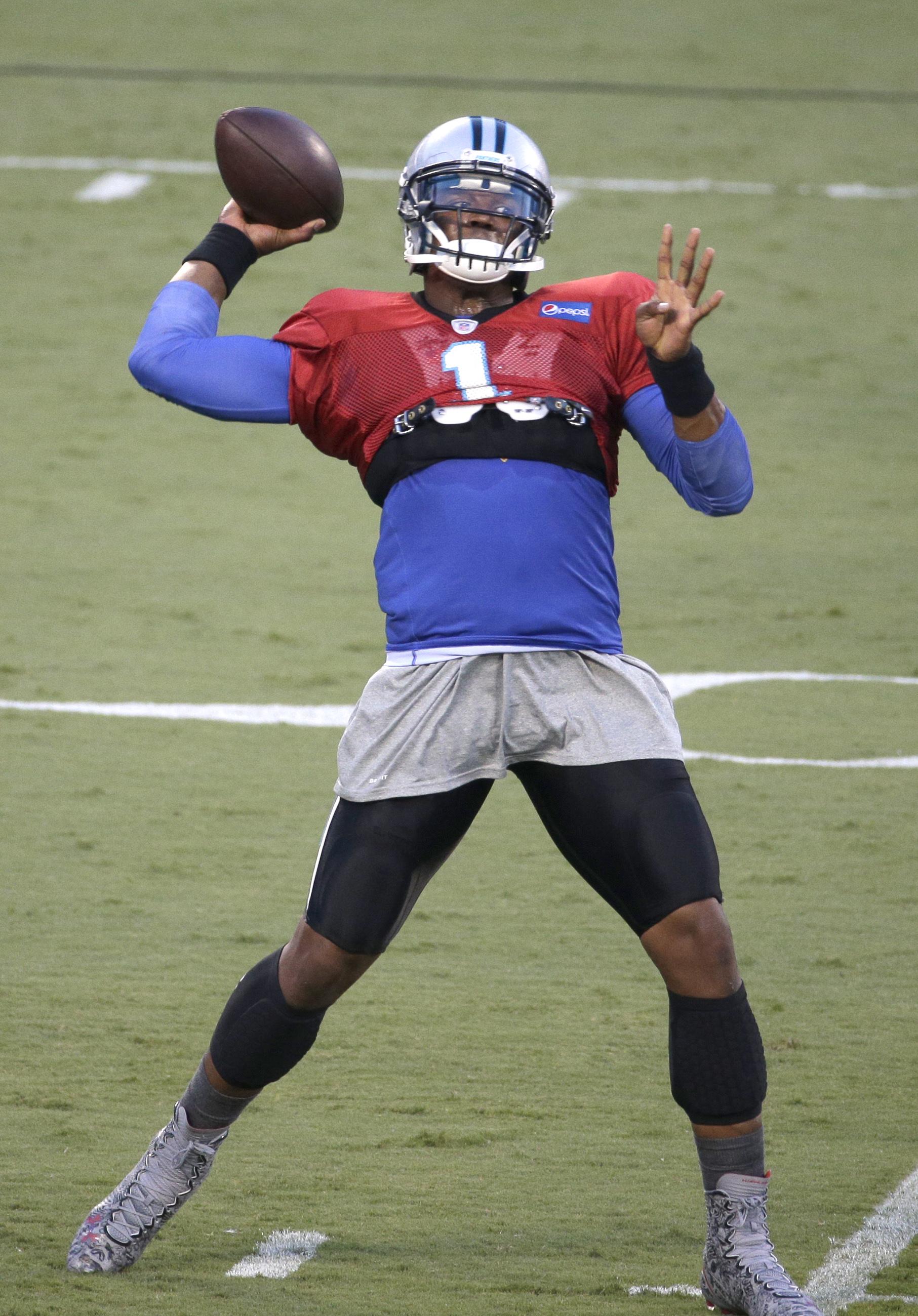 Newton doesn't throw at Panthers camp; Oher doesn't practice