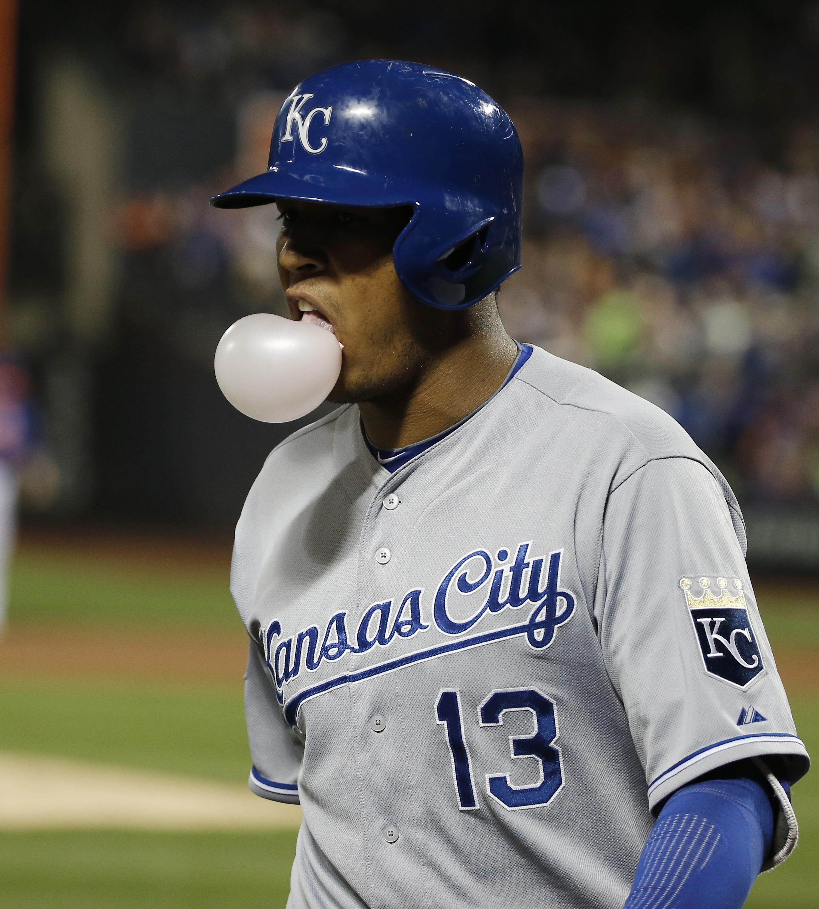 Kansas City Royals catcher Salvador Perez (13) blew a bubble