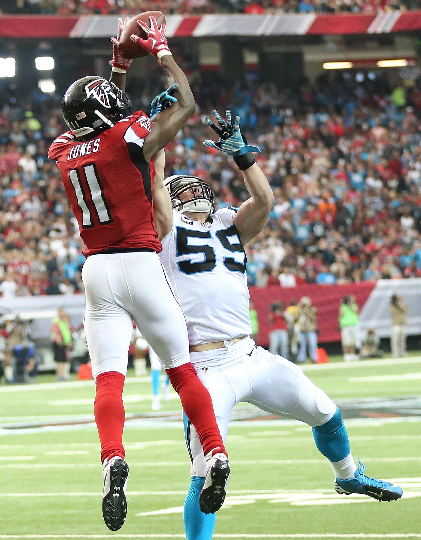 Julio Jones leaps over Luke Kuechly to make a phenomenal catch.