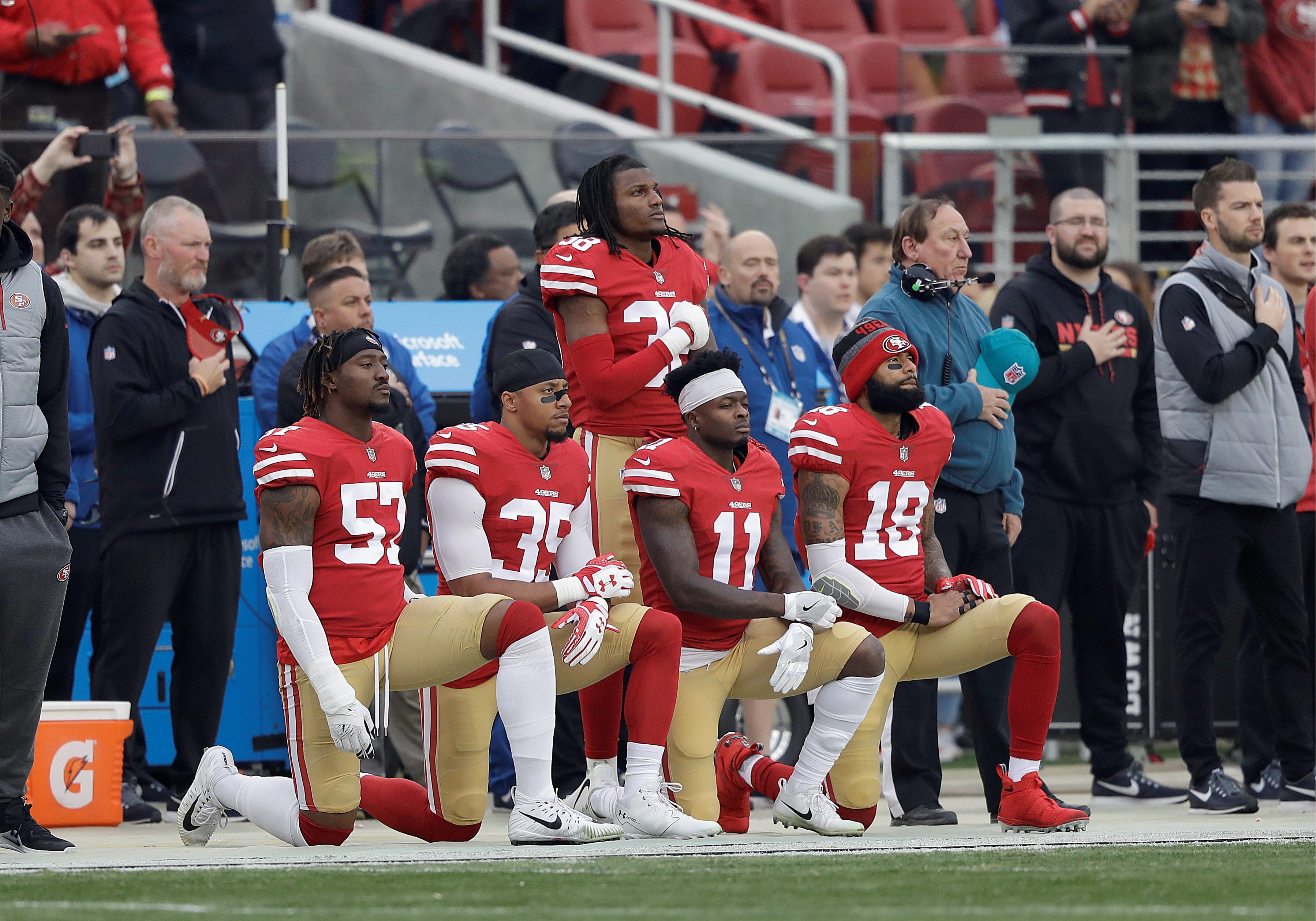 Nfl Players Raise Fists Kneel And Stay Off Field During