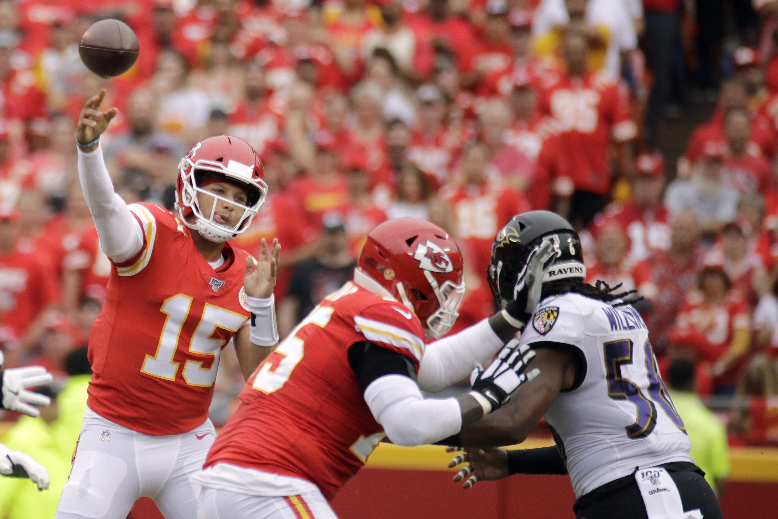 Kansas City Chiefs quarterback Patrick Mahomes (15) runs for a 12-yard  touchdown against the Chicago Bears in the first half of an NFL football  game in Chicago, Sunday, Dec. 22, 2019. (AP