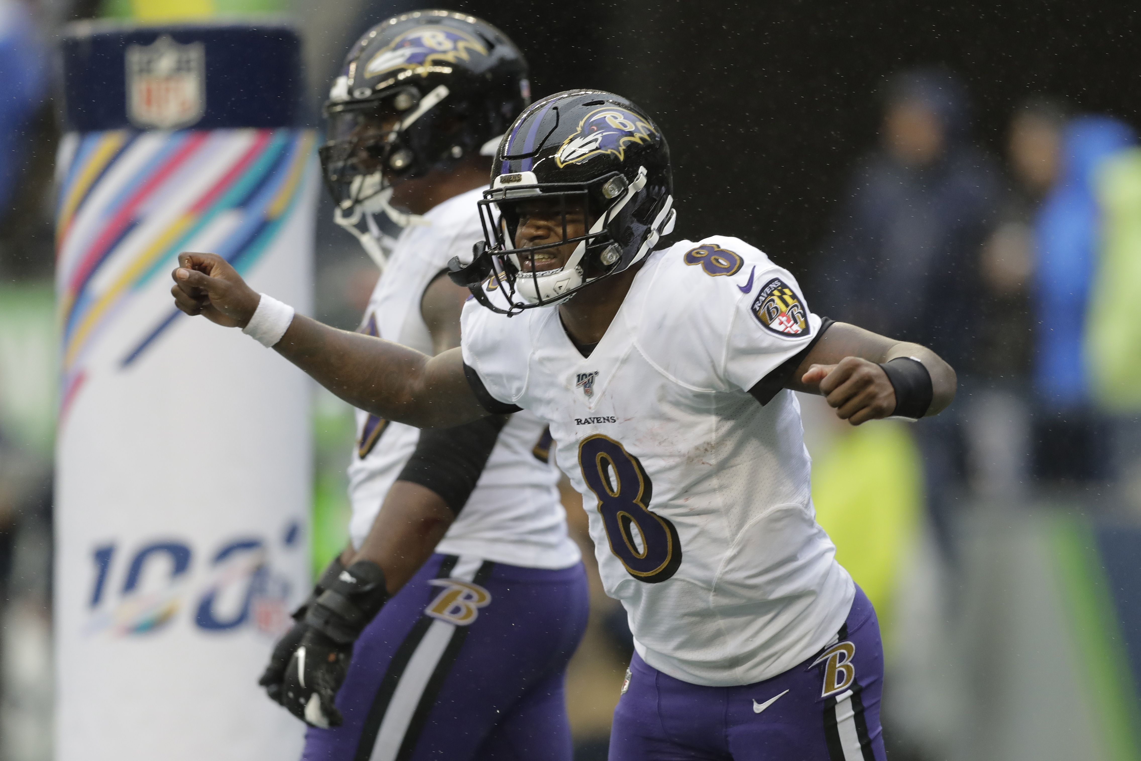 Lamar Jackson's legs, Ravens defense roll past Seahawks 30-16 - Washington  Times