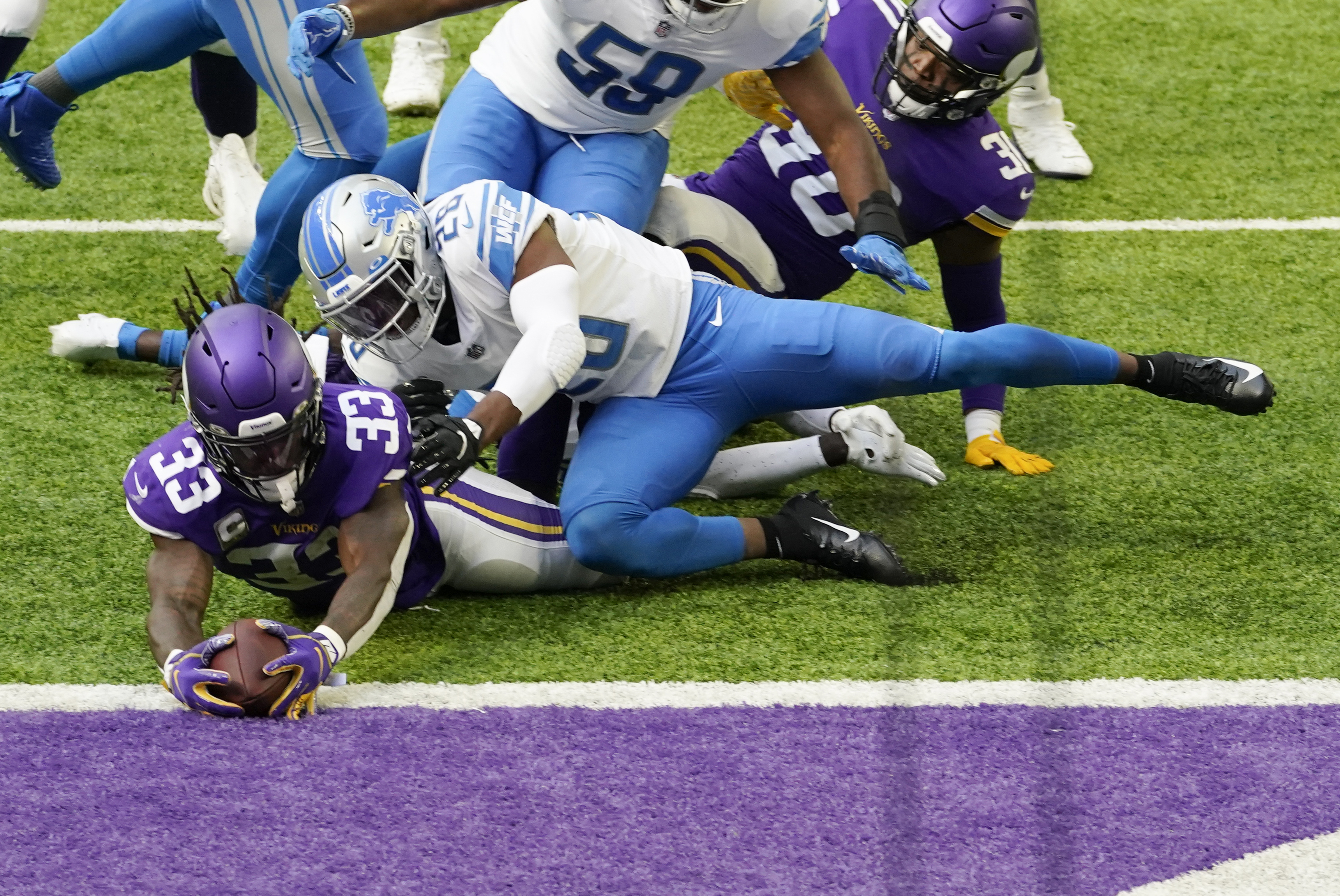 Minnesota Vikings running back Dalvin Cook (33) runs with the football  during the first half on …