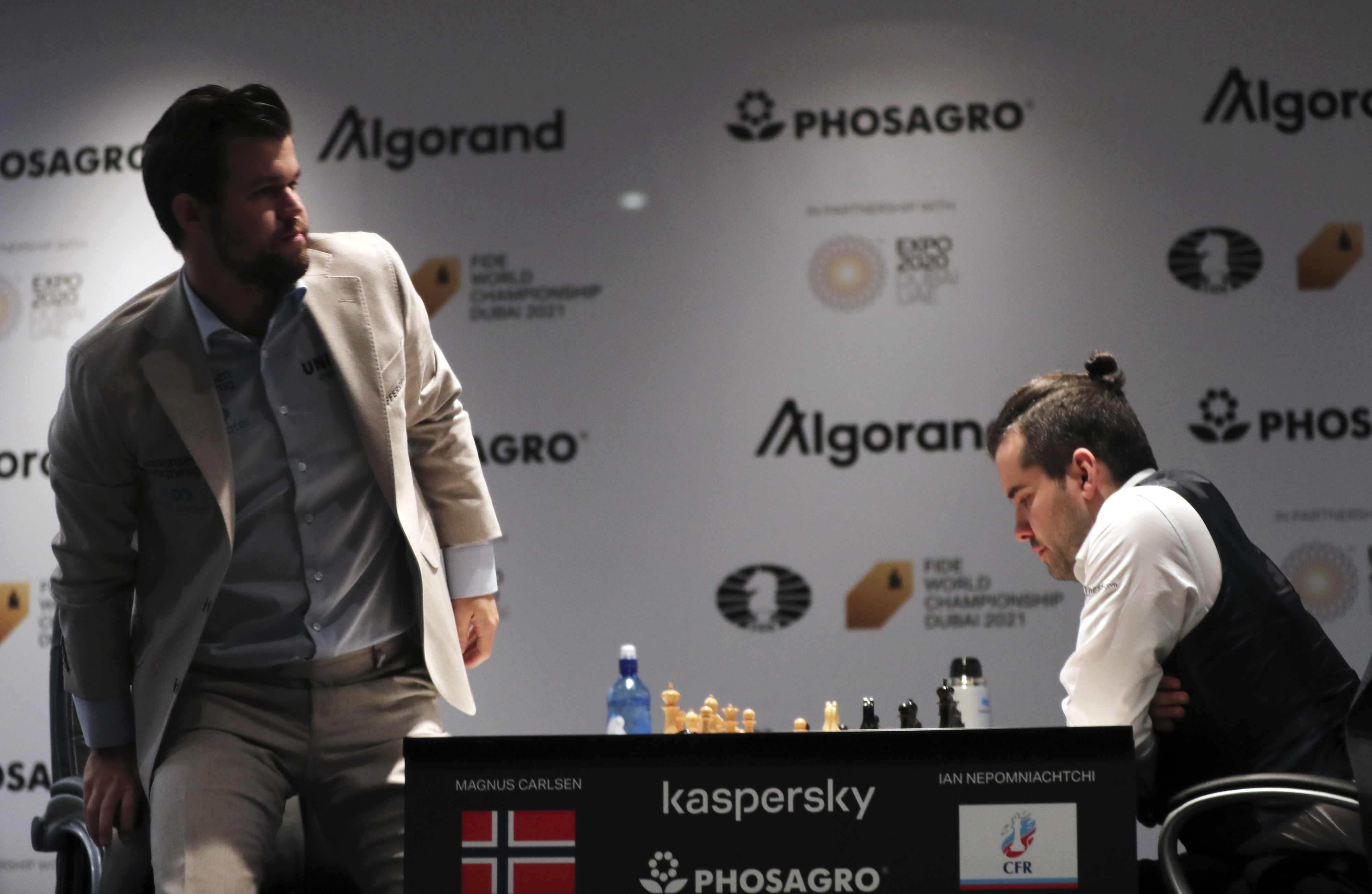 Magnus Carlsen and Fabiano Caruana play to quiet Game 11 draw – as