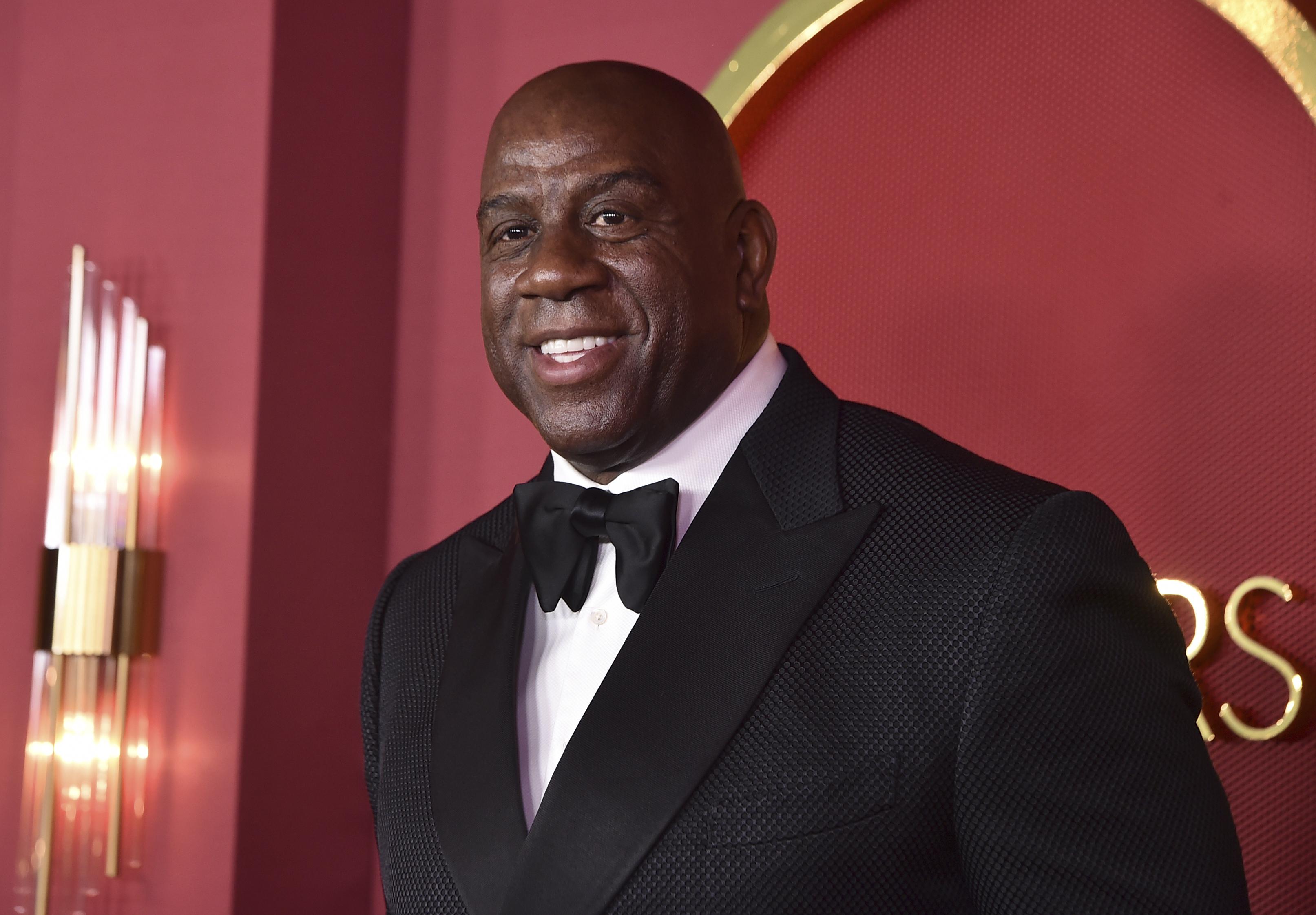 Magic Johnson's group 'beats Jeff Bezos to record-breaking