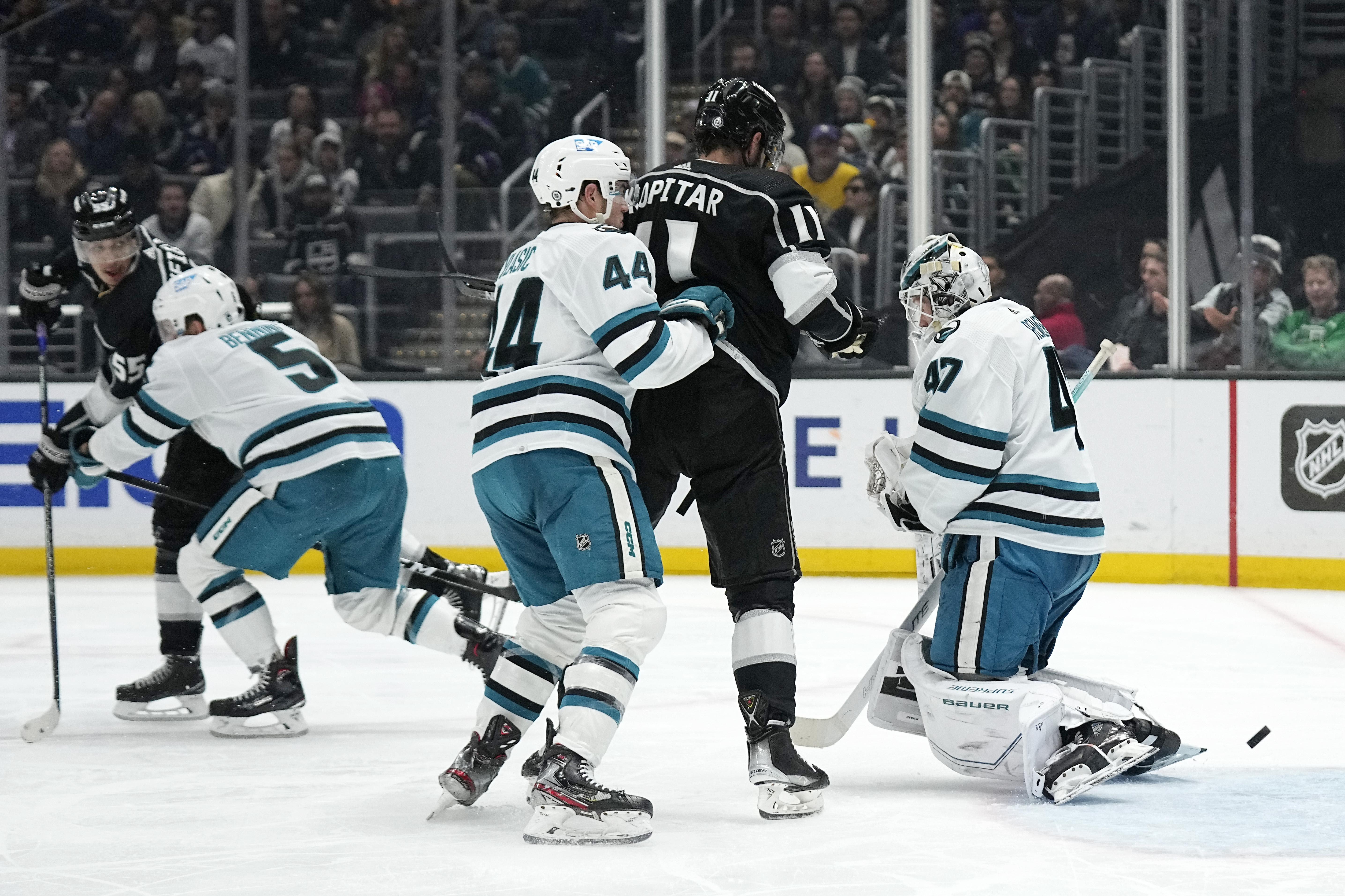 Anze Kopitar and Matt Greene of the Los Angeles Kings react after the