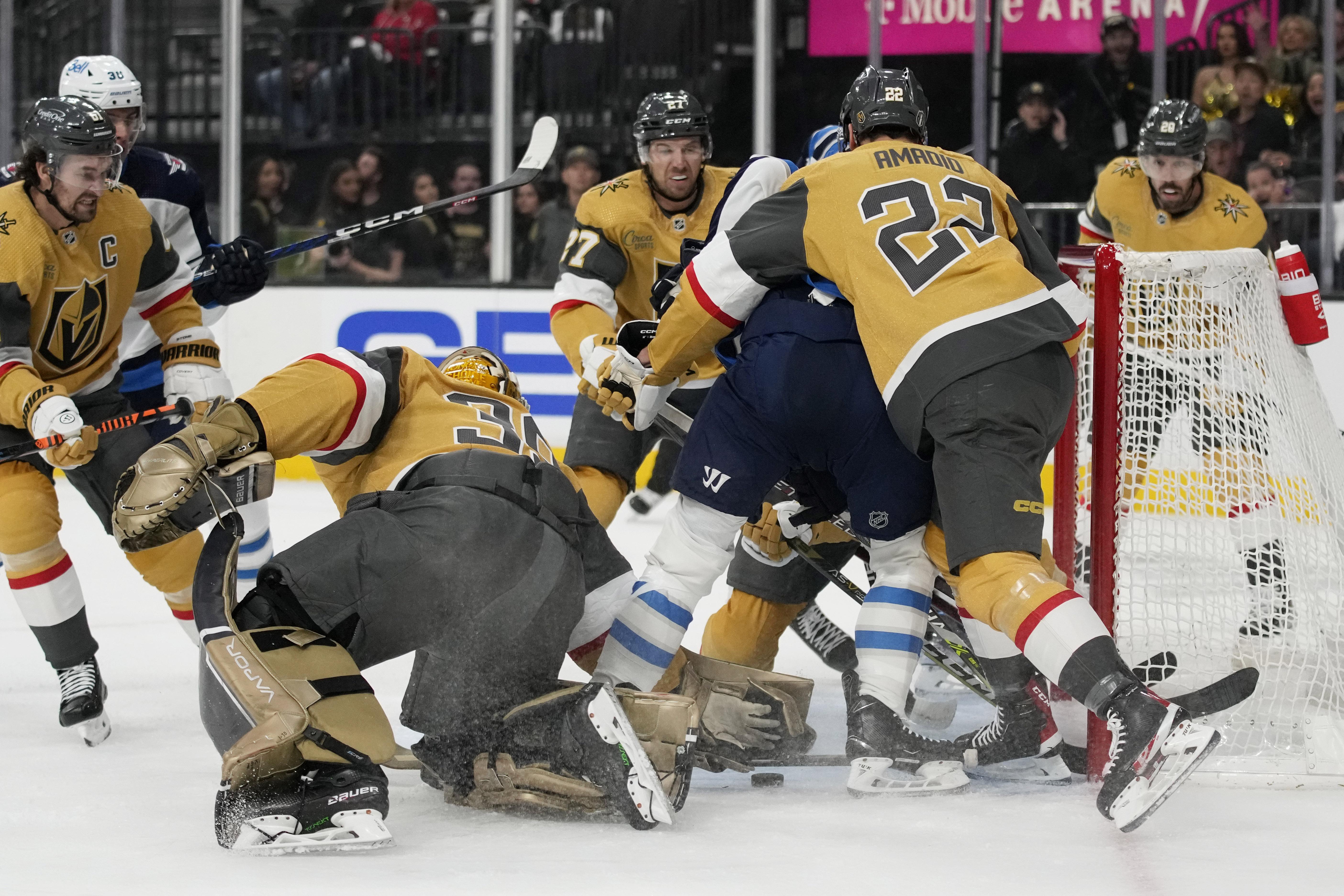 Lowry scores 2 as Jets beat Golden Knights 5-1 in Game 1