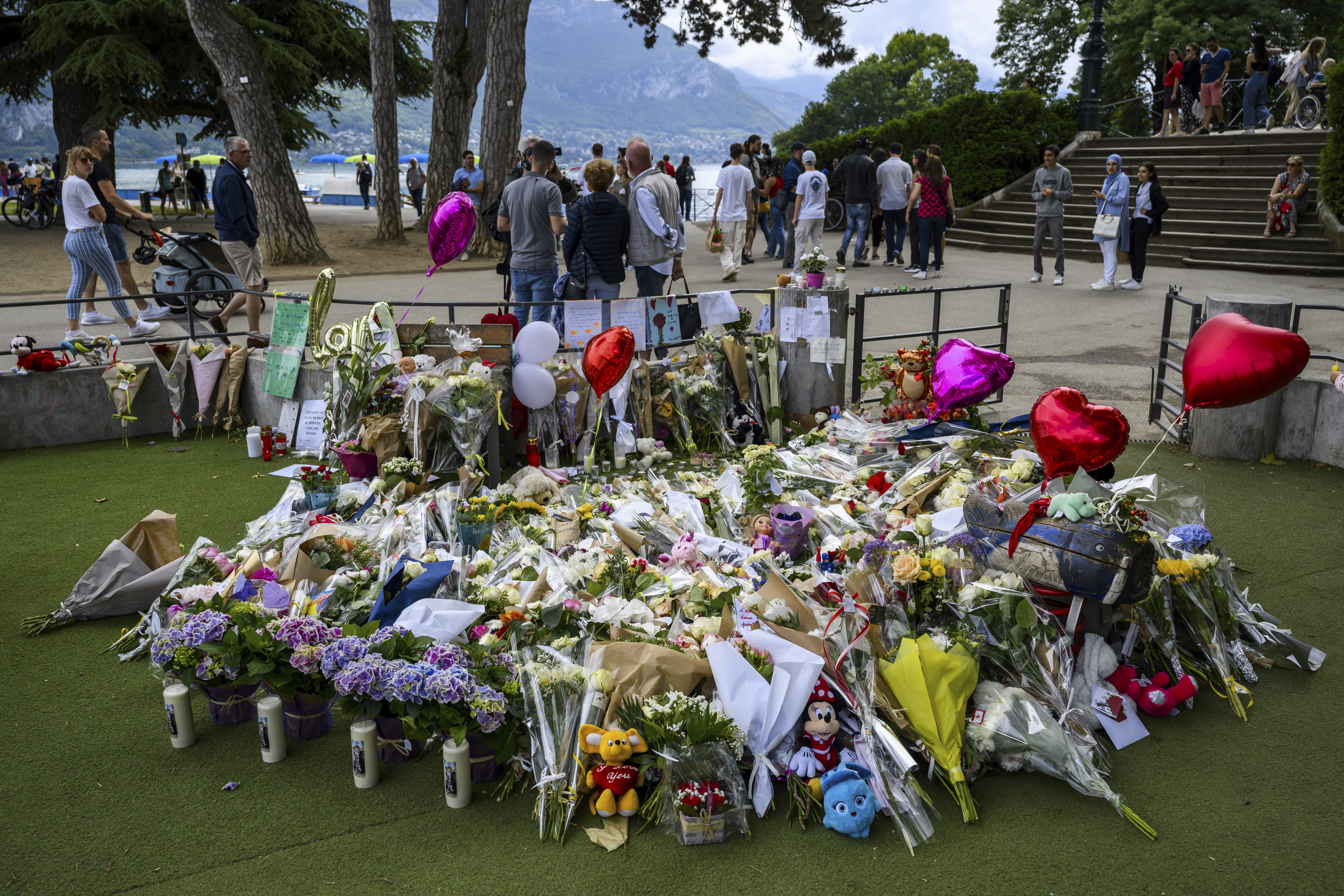 French town gathers at playground where young children were stabbed to support victims