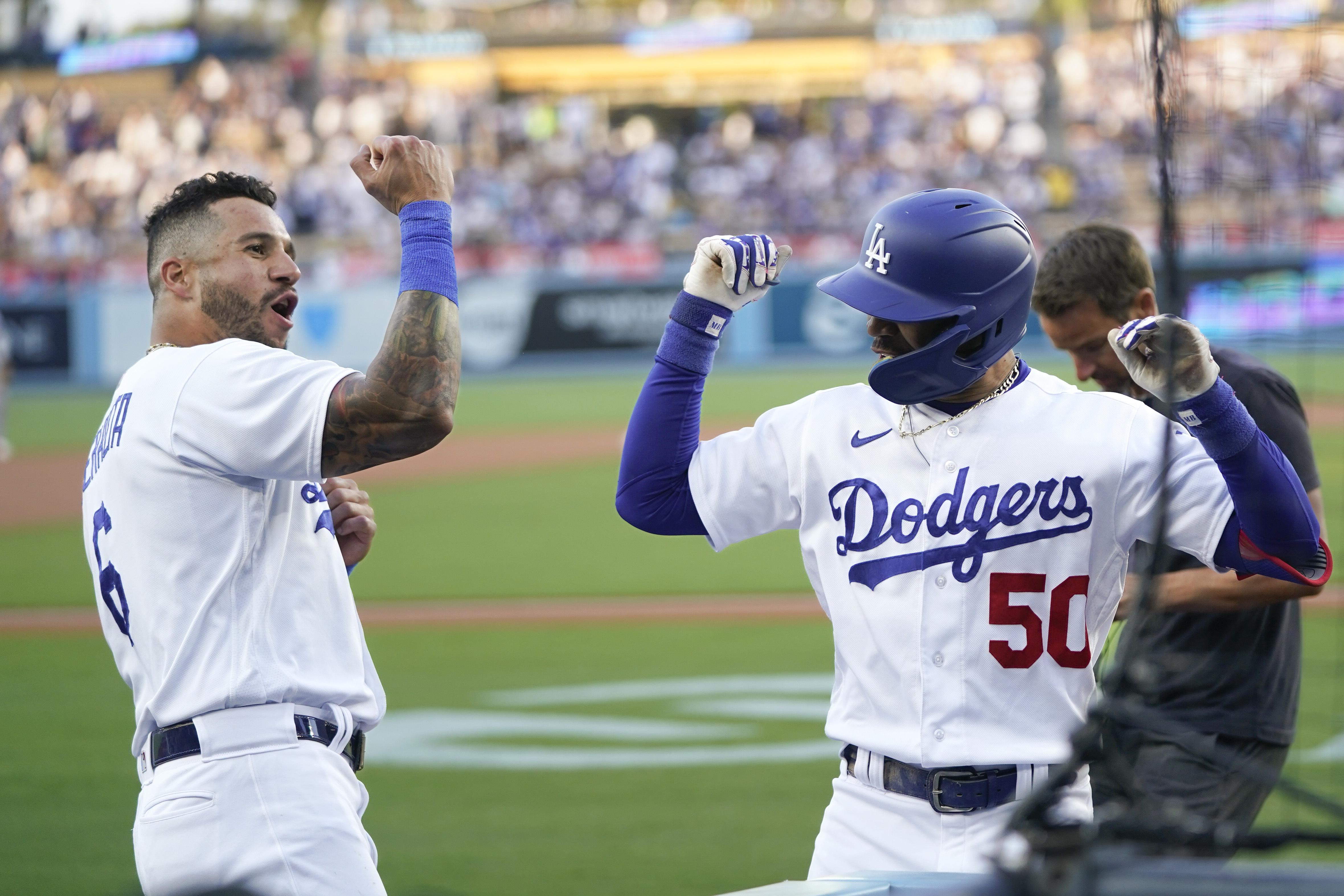 Dodgers take 2 behind hot-hitting Betts