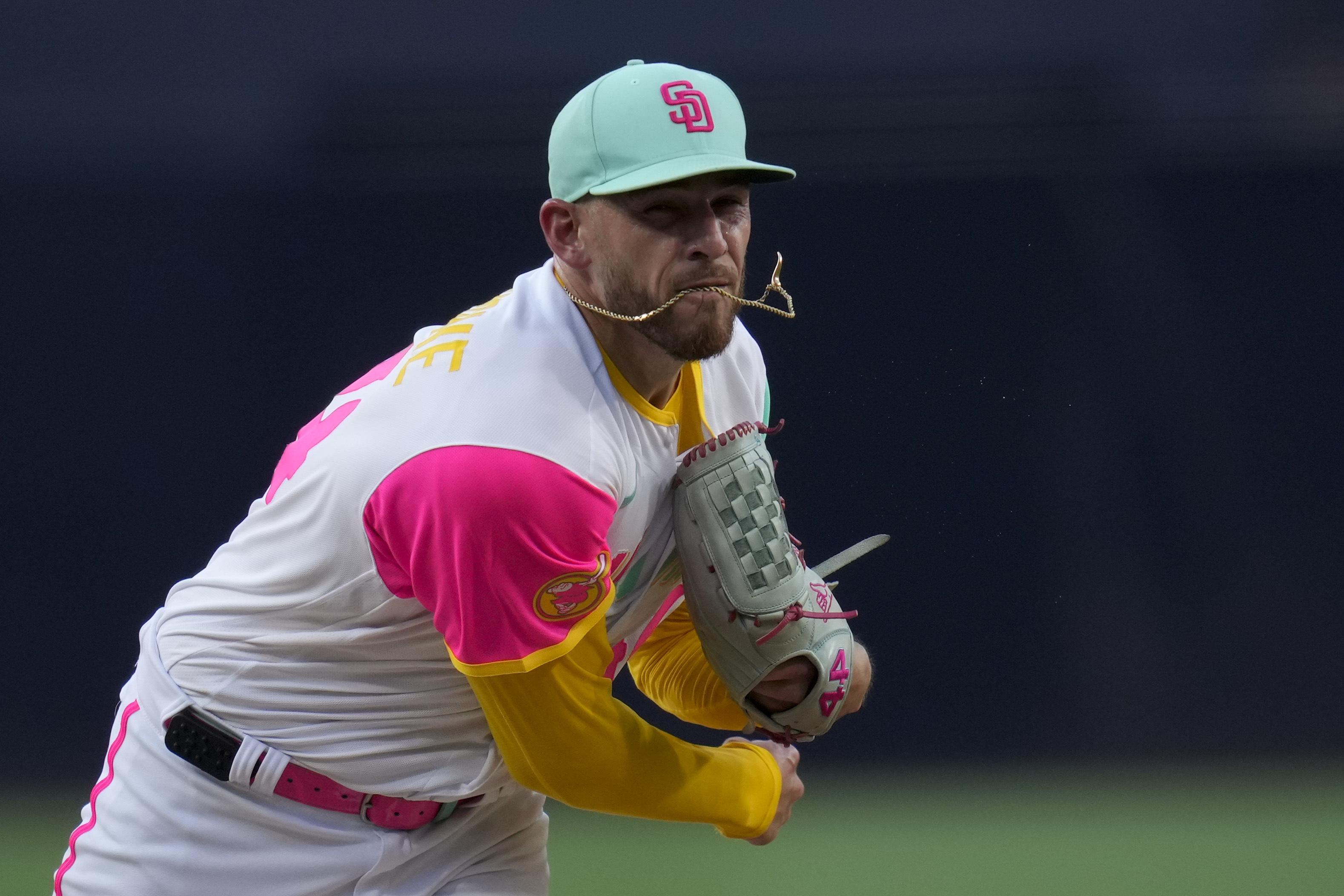 Former San Diego Padres pitcher Jake Peavy, left, reacts as he is