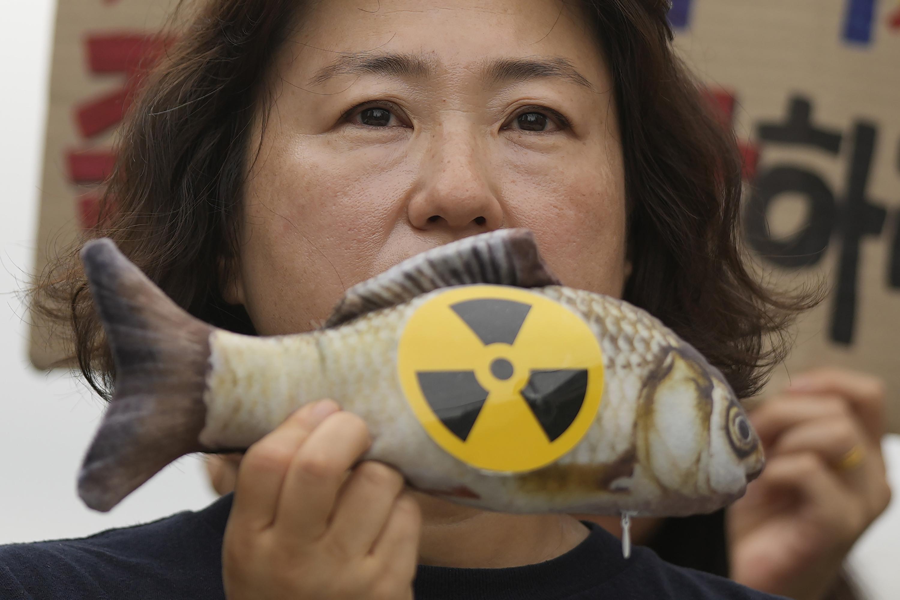 In Japans neighbors, fear and frustration are shared over radioactive water release photo