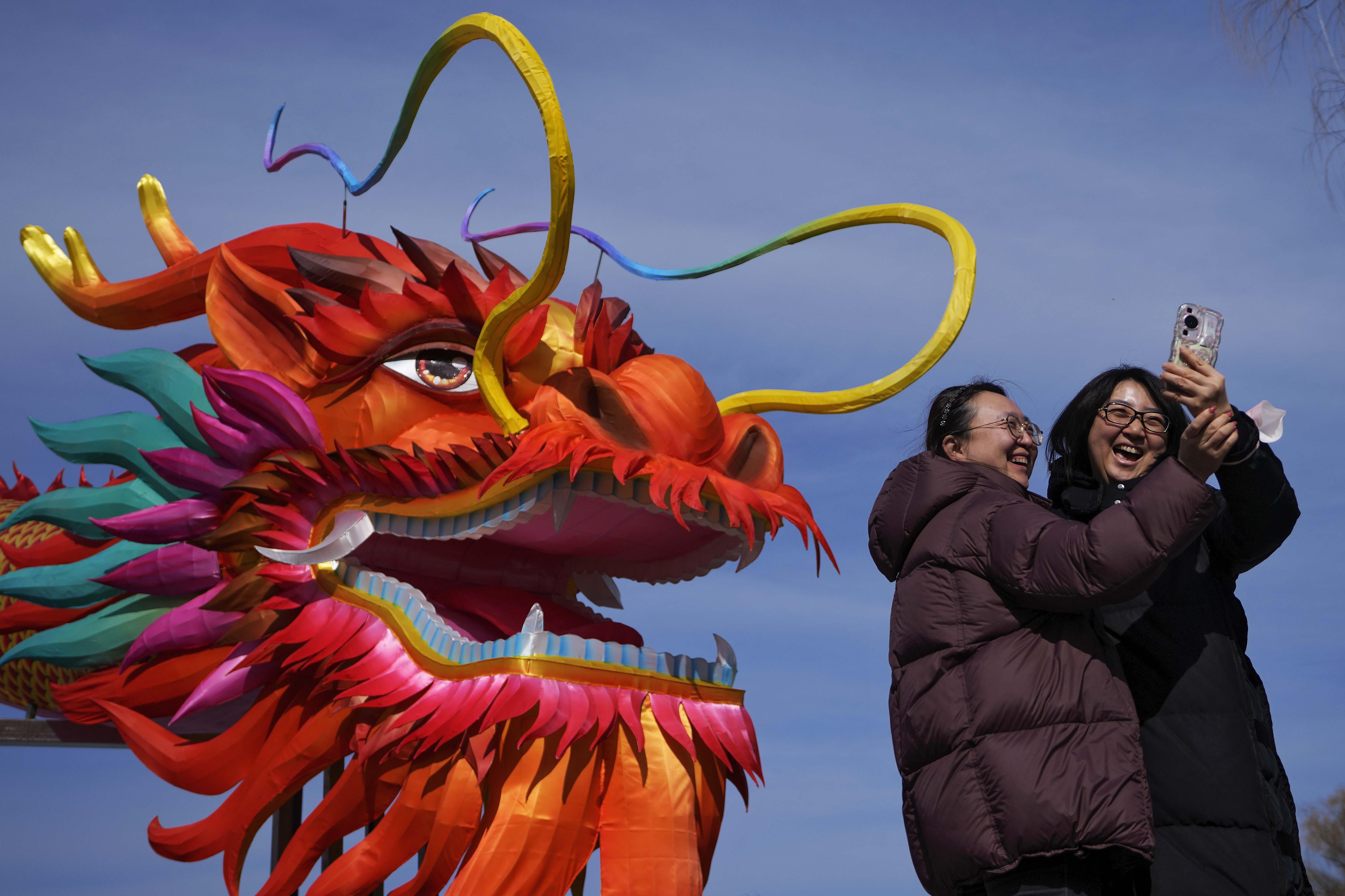 As Lunar New Year dawns across Asia, a blue dragon takes wing