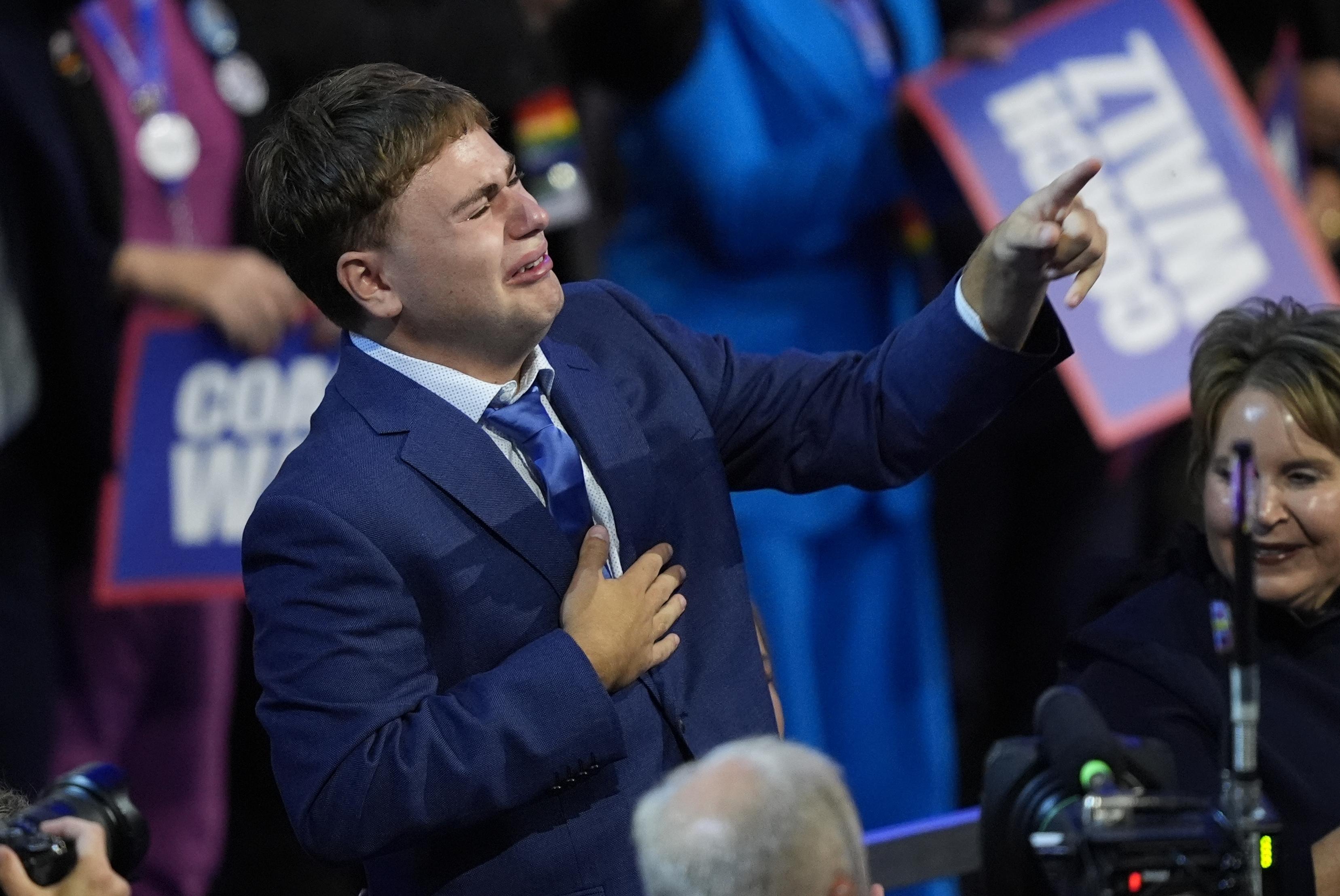 Gus Walz tearfully cheers on his father Tim as he accepts Democratic VP nomination - Washington Times